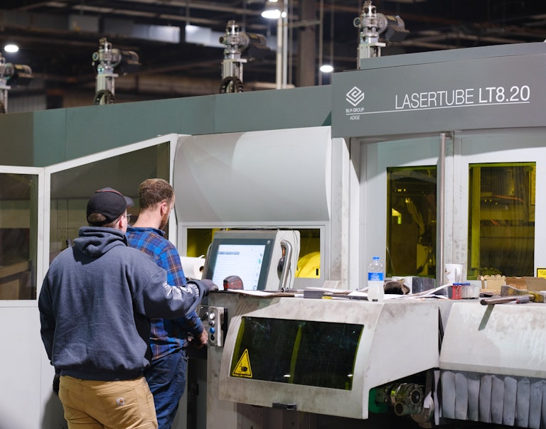 Fabritech employees at Laser Tube Cutting Machine